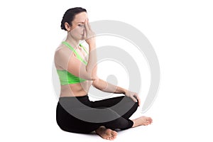 Nadi shodhana pranayama in yoga easy pose photo