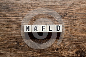 NAFLD Non Alcoholic Fatty Liver Disease, word concept on building blocks photo