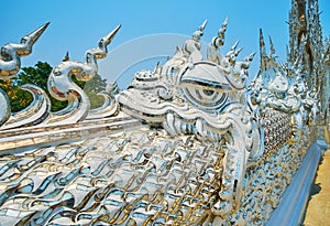 Naga serpents on Bridge of Rebirth Cycle, White Temple, Chiang Rai, Thailand