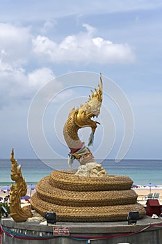 Naga statue karon beach phuket thailand photo