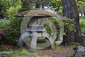 Nagano, Japan - June 3, 2017: Stone lantern vovered with moss i