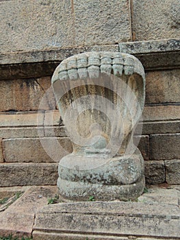 Nagas stone statue in India, representation of snakes in hinduism