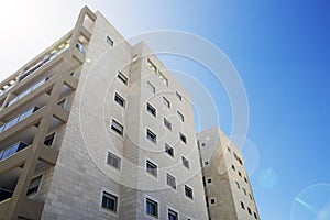 NAHARIYA, ISRAEL-MARCH 9, 2018: High residential building against a blue sky in Nahariya, Israel