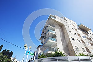 NAHARIYA, ISRAEL-MARCH 9, 2018: High residential building against a blue sky in Nahariya, Israel