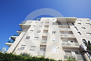 NAHARIYA, ISRAEL-MARCH 9, 2018: High residential building against a blue sky in Nahariya, Israel