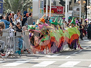 Participants in a Chinese dragon costume in the carnival of Adloyada in Nahariyya, Israel