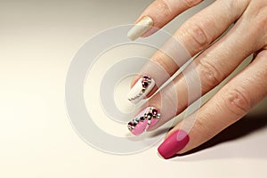 Nail art with various shaped rhinestones photo