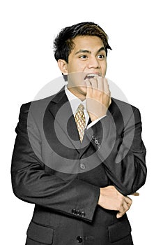 Nail-biting stressed Indian businessman