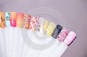 Nail Care And Manicure concept. Multicolor Nail Polish palette for Client`s Nails choise. Woman In Beauty Salon. Copyspace for