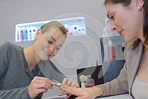 Nail care in salon selective focus on costumers nails