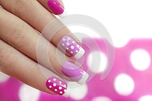 Nail design with white dots.