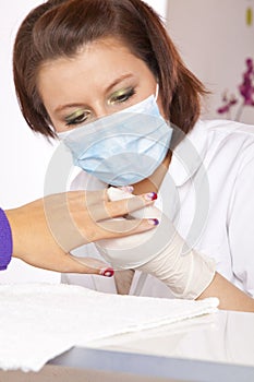 Nail designer checking acrylic fingernails