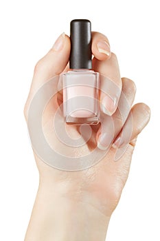 Nail polish bottle in woman hand