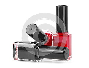 Nail polish bottles isolated on white background. Three colored bottles with nail polish