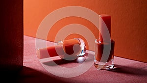 Nail polish bottles on red ground