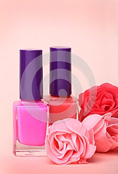 Nail polish bottles and rose flowers