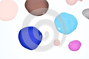 Nail polish enamel mixed multicolor samples, isolated on white background