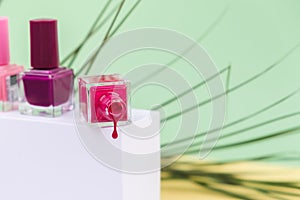 Nail polish isolated on pink background