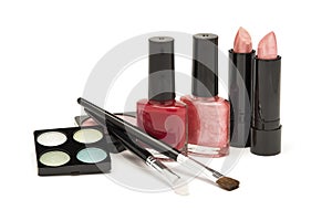 Nail polish, lipstick and blusher on a white background