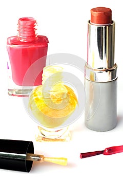 Nail polish and lipstick isolated on white