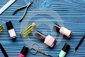 Nail polish and manicure set on dark wooden background