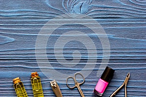 Nail polish and manicure set on dark wooden background