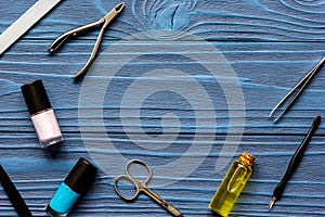 Nail polish and manicure set on dark wooden background