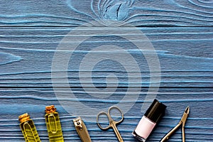 Nail polish and manicure set on dark wooden background