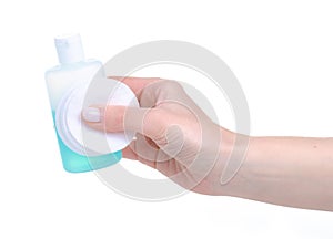 Nail polish remover with cotton pads in hand photo