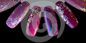Nail polish samples close up, isolated on a black background. colorful manicure in different colors such as dark red