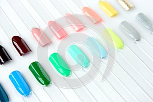 Nail polish samples in different bright colors.