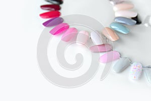 Nail polish samples in different bright colors. Colorful nail lacquer manicure swatches.