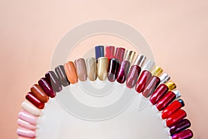 Nail polish samples in different bright colors. Colorful nail lacquer manicure swatches. nail art wheel palette.Top view