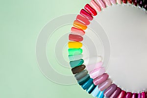 Nail polish samples in different bright colors. Colorful nail lacquer manicure swatches. nail art wheel palette.Top view