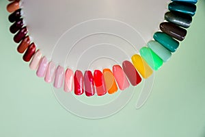 Nail polish samples in different bright colors. Colorful nail lacquer manicure swatches. nail art wheel palette.Top view