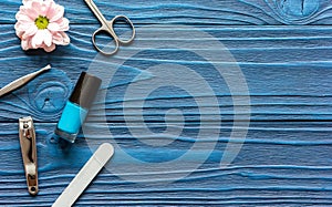 Nail polish and spa manicure set on dark wooden background