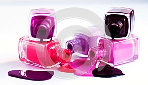 Nail Polish various shades of pink poured from a bottle