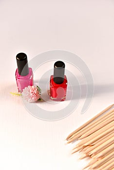 nail polish and wooden sticks for manicure and pedicure