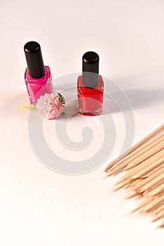 nail polish and wooden sticks for manicure and pedicure