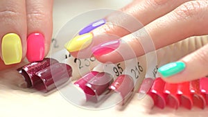 Nail samples and multicolored manicure.