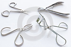 Nail scissors and other accessories on a white background