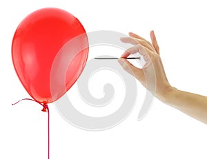 Nail about to pop a balloon