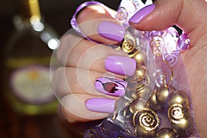 Nails art design on the background of the bag with the jewelry