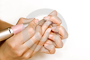 Nails Beauty. Closeup Of Woman Hands Receiving Nail Care Treatment.Manicurist Hands Cutting Cuticle On Nails With Nail Clippers