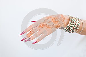 Nails decorated with brilliant and hand with henna tattoos