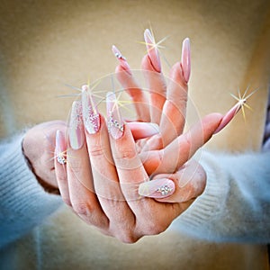 Nails decorated with pink and white color