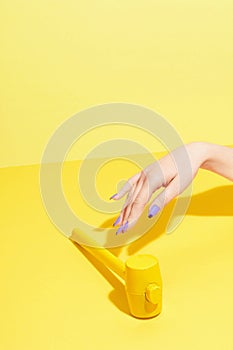 Nails Design. Hand With Colorful Nails On Yellow Background