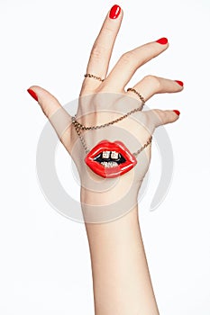 Nails Design. Hands With Red Manicure And Red Lips