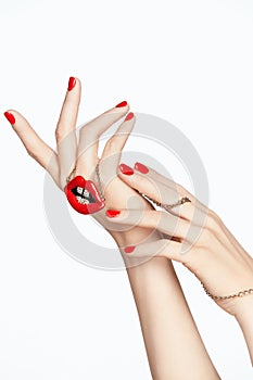 Nails Design. Hands With Red Manicure And Red Lips