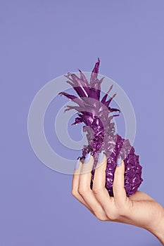 Nails Manicure. Hand With Stylish Nails Holding Purple Pineapple